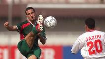 Tunisia's Tahar El Khalej looks at Moustapha Hadji (L) kicking the ball Morocco's Jamal Sellami during their African Nations Cup match Morocco vs Tunisia 29 January 2000 in Lagos. Morocco joined Nigeria at the top of the Group D in the African Nations Cup by drawing 0-0 with Tunisia. (ELECTRONIC IMAGE) AFP PHOTO (Photo by Olivier MORIN / AFP) (Photo credit should read OLIVIER MORIN/AFP via Getty Images)