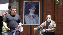 صورة لرئيس النظام السوري، بشار الأسد بدمشق (لؤي بشارة/ فرانس برس)