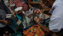 مساعدات غذائية وسط كورونا في البرازيل (ألكسندر شنايدر/ Getty)