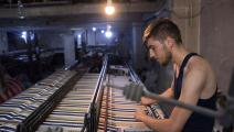 ورشة منسوجات في مدينة حلب (فرانس برس)