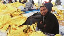 مهاجرون في ميناء الكتف في مدينة بن قردان في تونس (فتحي الناصري/ فرانس برس)