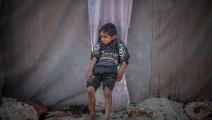 طفل سوري في أحد مخيمات إدلب (محمد سعيد/الأناضول)