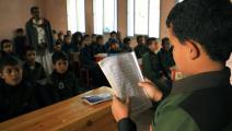 يقرأ بعض الآيات القرآنية في إحدى مدارس صنعاء (محمد حويس/ فرانس برس)