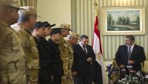الرئيس الراحل مرسي ورئيس حكومته هشام قنديل (فرانس برس)