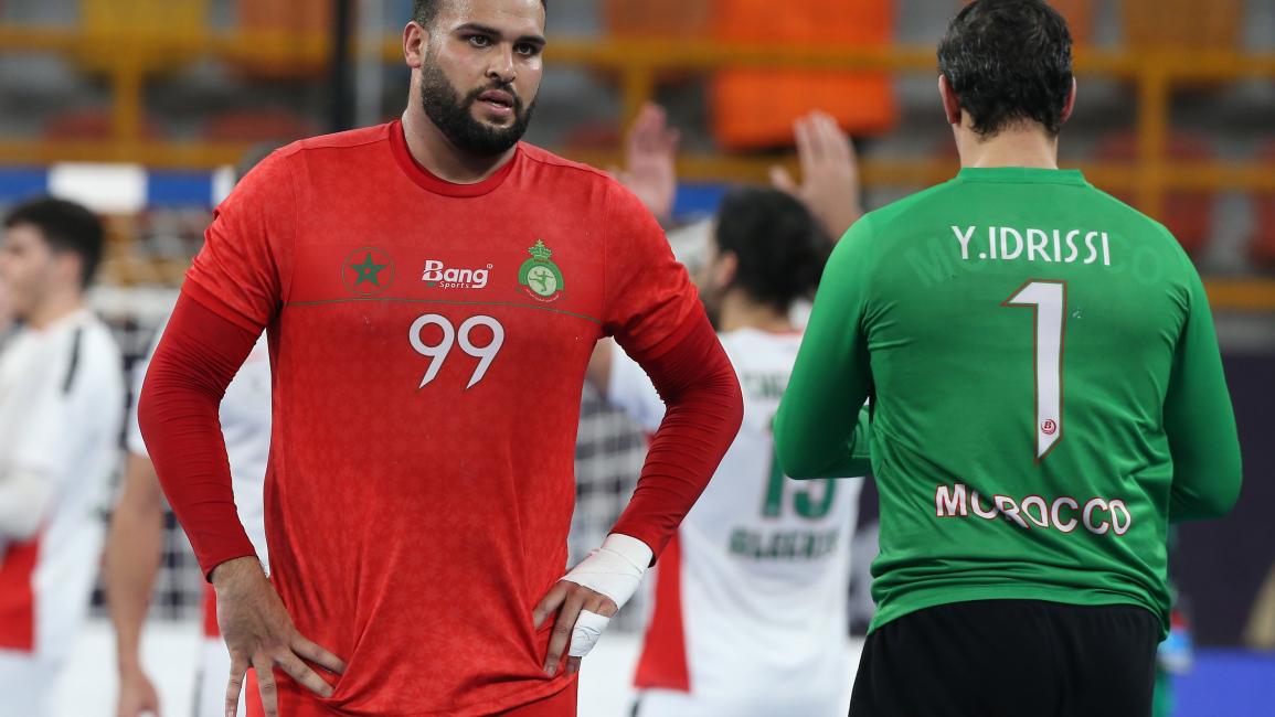 Morocco's pivot Nabil Slassi and Morocco's goalkeeper Yassine Idrissi react to their defeat in the 2021 World Men's Handball Championship between Group F teams Algeria and Morocco at the New Capital Sports Hall in the Egyptian capital Cairo on January 14, 2021. (Photo by Khaled ELFIQI / POOL / AFP) (Photo by KHALED ELFIQI/POOL/AFP via Getty Images)