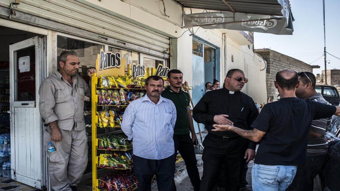 عاد مسيحيون عراقيون لمناطقهم ليكتشفوا بيع أملاكهم (مارتن أيم/Getty)