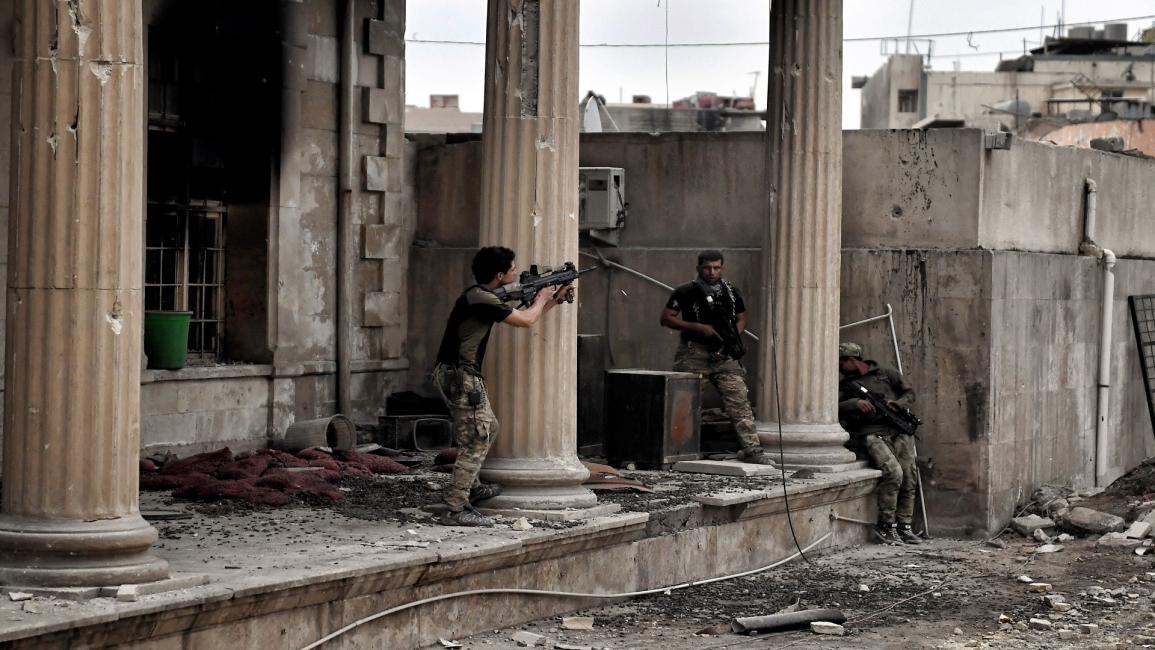 اشتباكات بين القوات العراقية و"داعش" بالموصل القديمة/أريس ميسنيس/فرانس برس