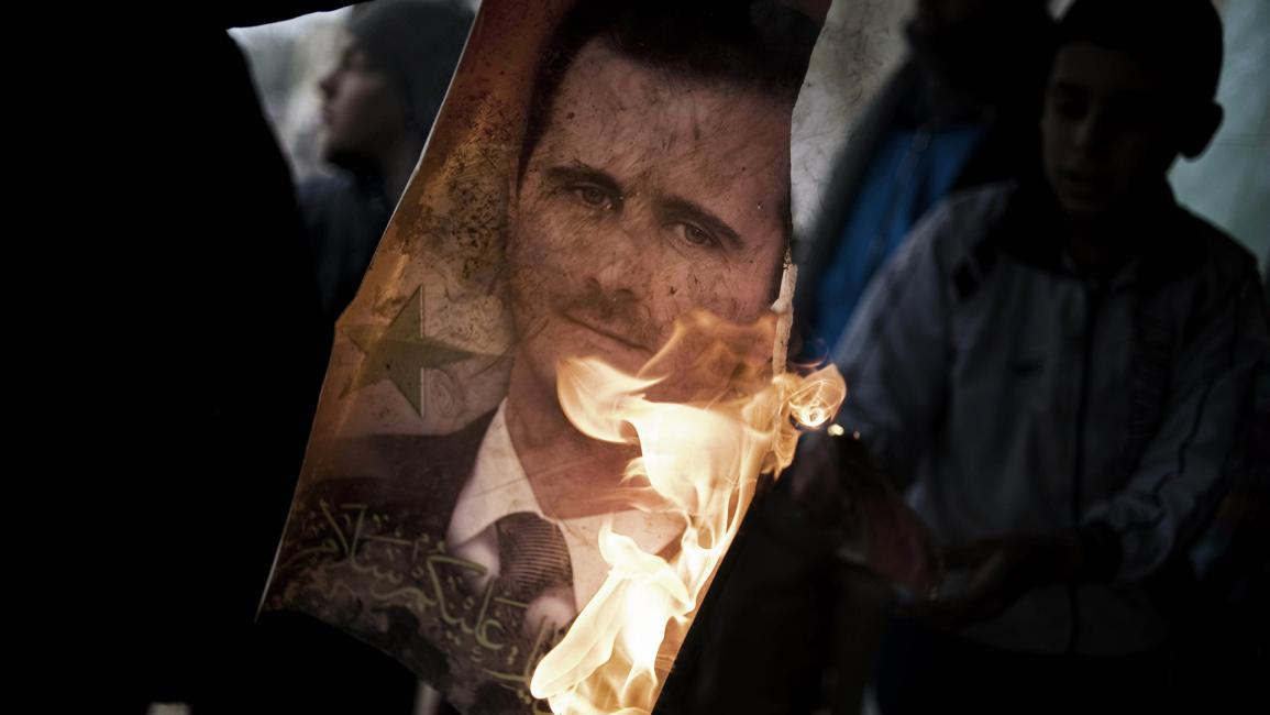 حرق صورة بشار الأسد 