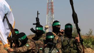 مقاتلون كتائب القسام في عرض عسكري في غزة، 19 يوليو 2023 (Getty)