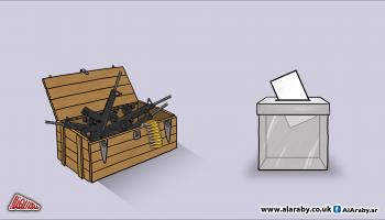مقالات كاريكاتير صندوق انتخابات وصندوق سلاح