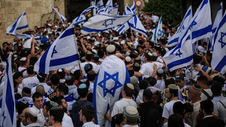 مستوطنون يشاركون في مسيرة الأعلام في القدس المحتلة، 18 مايو 2023 (Getty)