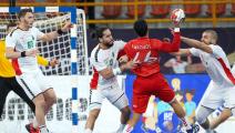 Morocco's centre back Harchaoui Amine (2nd-R) is challenged by Algeria's wing Riad Chehbour (2nd-L) and Algeria's left back Hichem Daoud (R) during the 2021 World Men's Handball Championship between Group F teams Algeria and Morocco at the New Capital Sports Hall in the Egyptian capital Cairo on January 14, 2021. (Photo by Khaled ELFIQI / POOL / AFP) (Photo by KHALED ELFIQI/POOL/AFP via Getty Images)